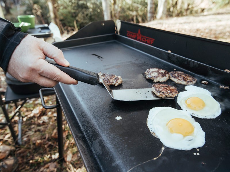 Cooking breakfast while camping